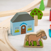 Слика на Дрвен железнички сет „ Во Град и на Село“ 91 елемент – Town & Country Train Set – Bigjigs Toys